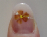 Hand Painted Bronze Flower With White Dots
